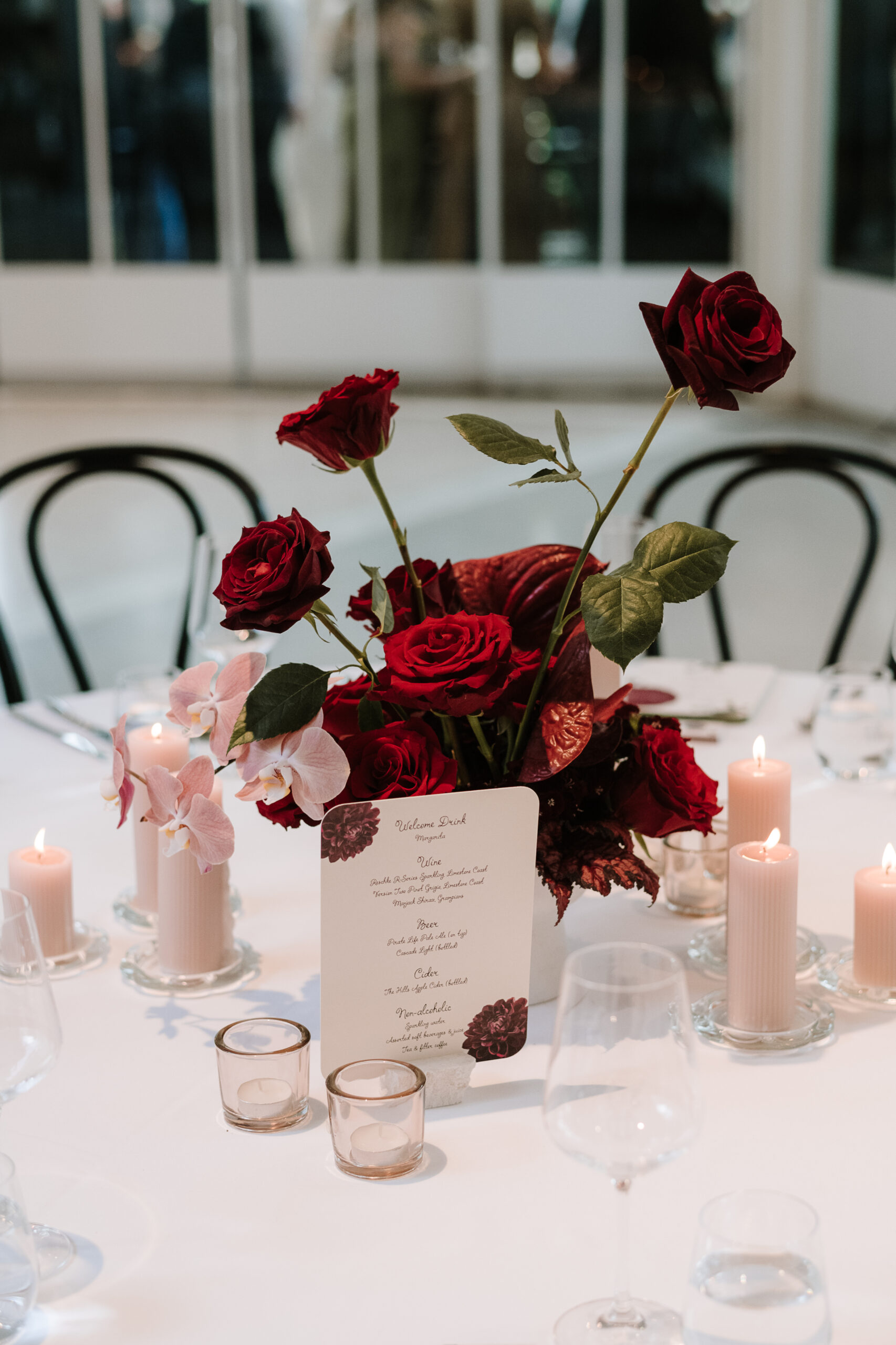 Individual place settings with custom menus and white ink place cards