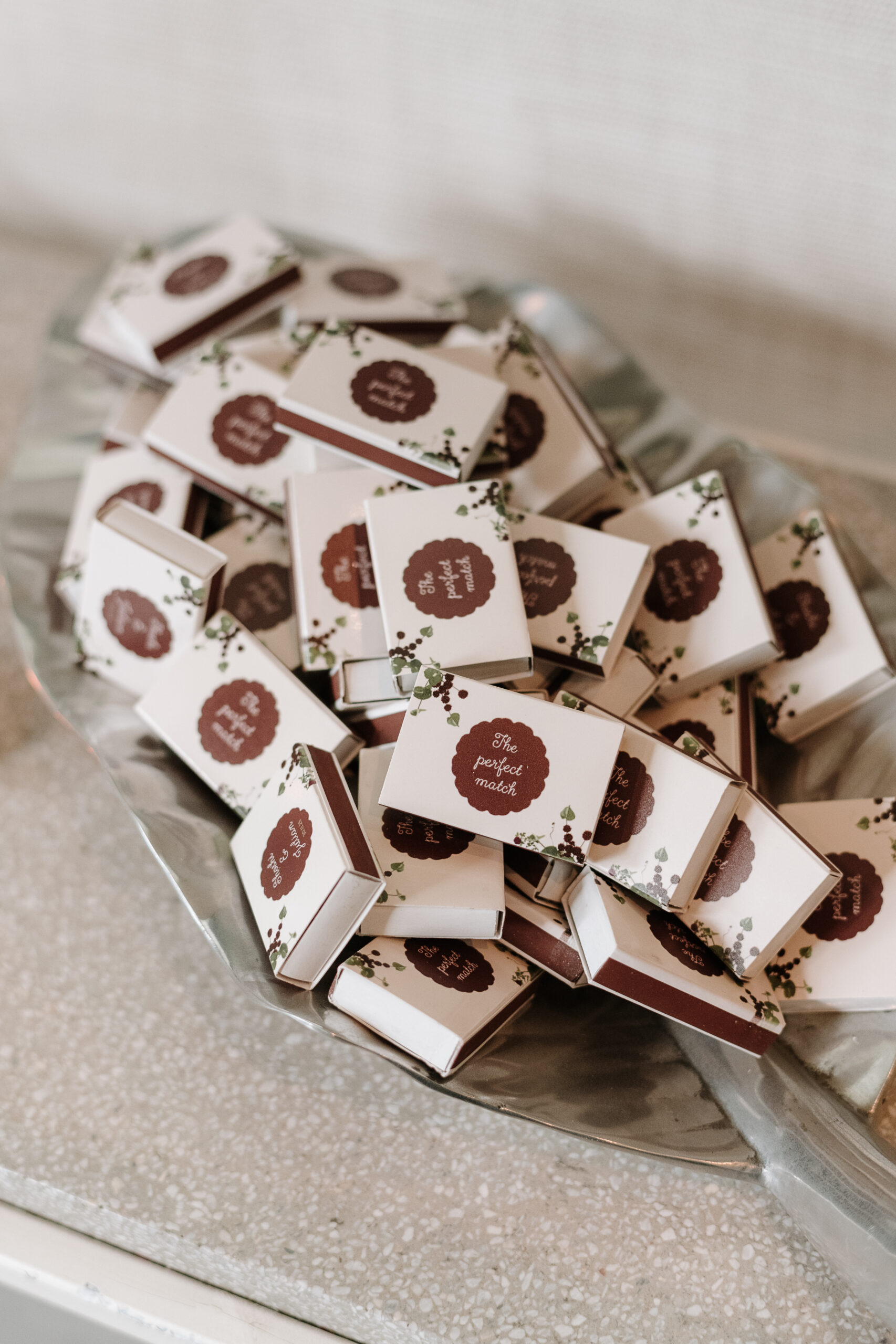 Close-up of white ink lettering on custom floral place cards